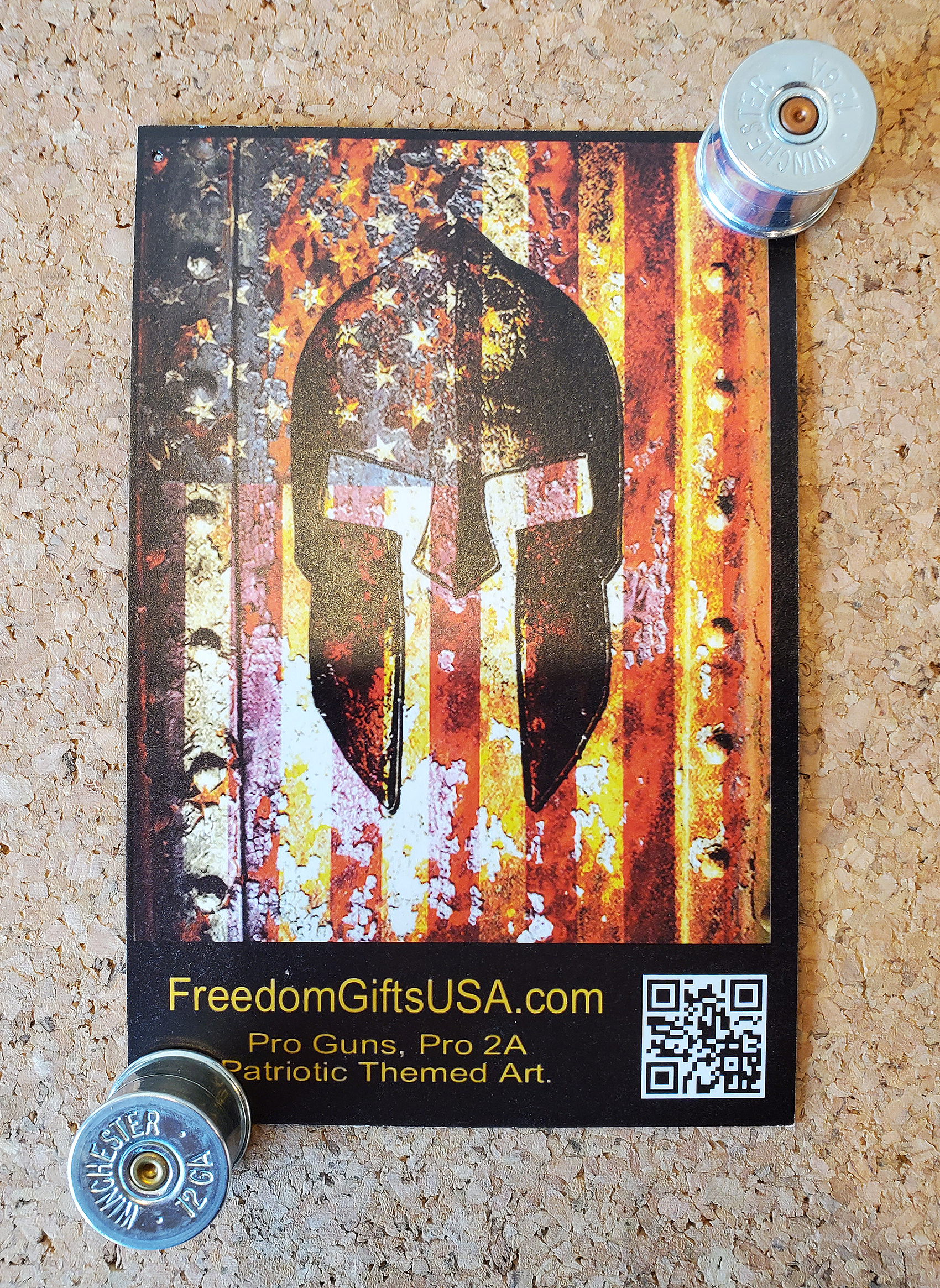 Two 12 gauge nickel push pins holding card