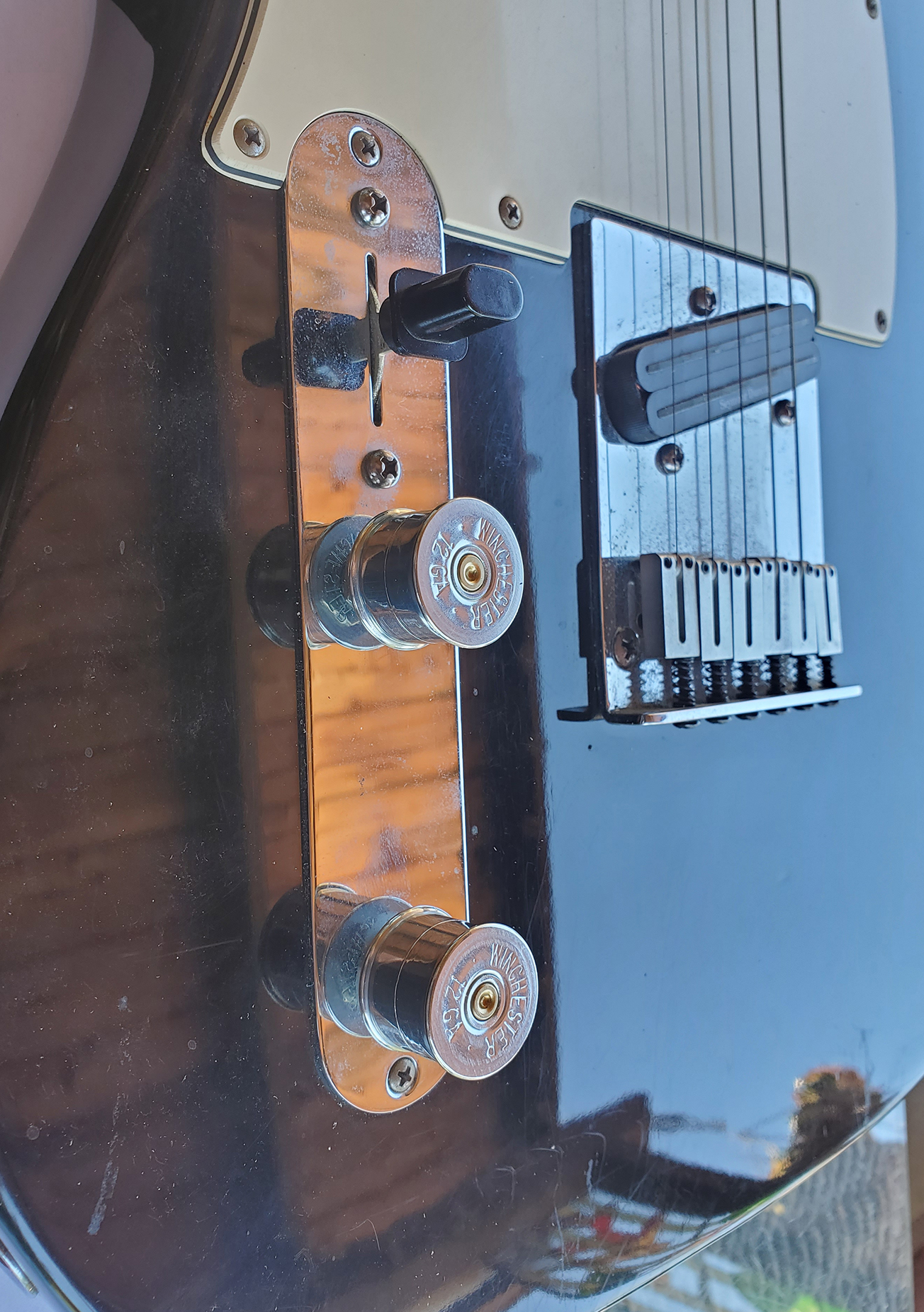 Set of 2 guitar knobs made with the case heads of nickel Winchester shot gun shells on Telecaster Guitar